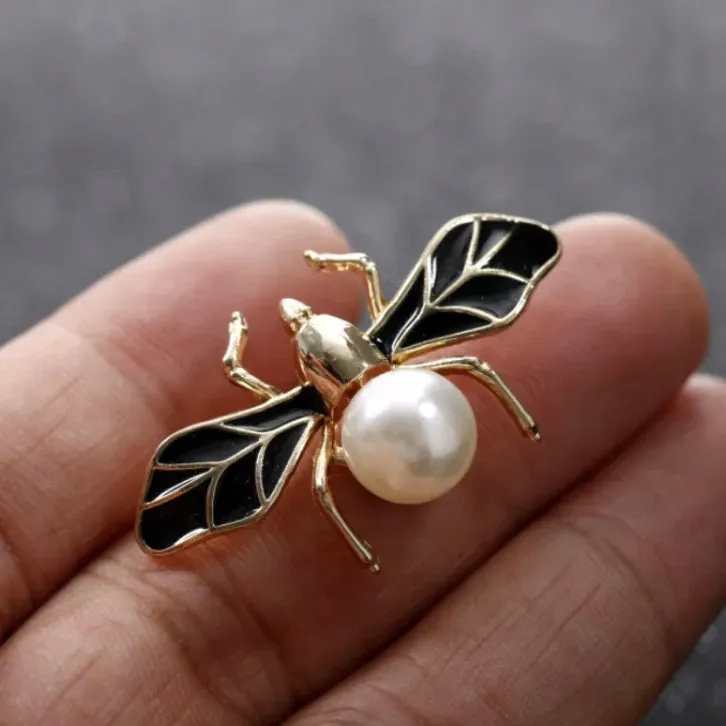 Golden fly insect with pearl enamel pin
