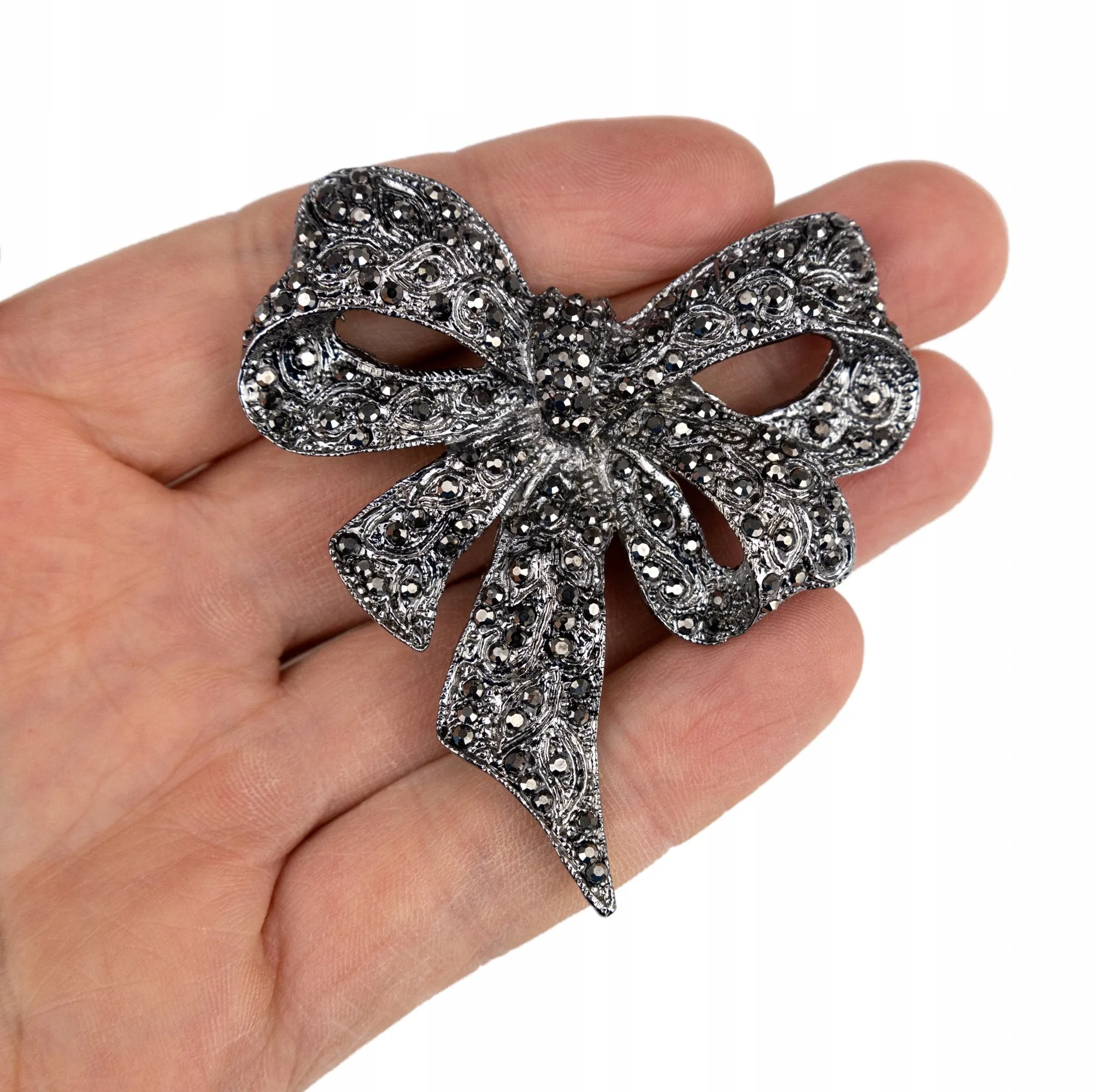 Silver bow with zircons - brooch