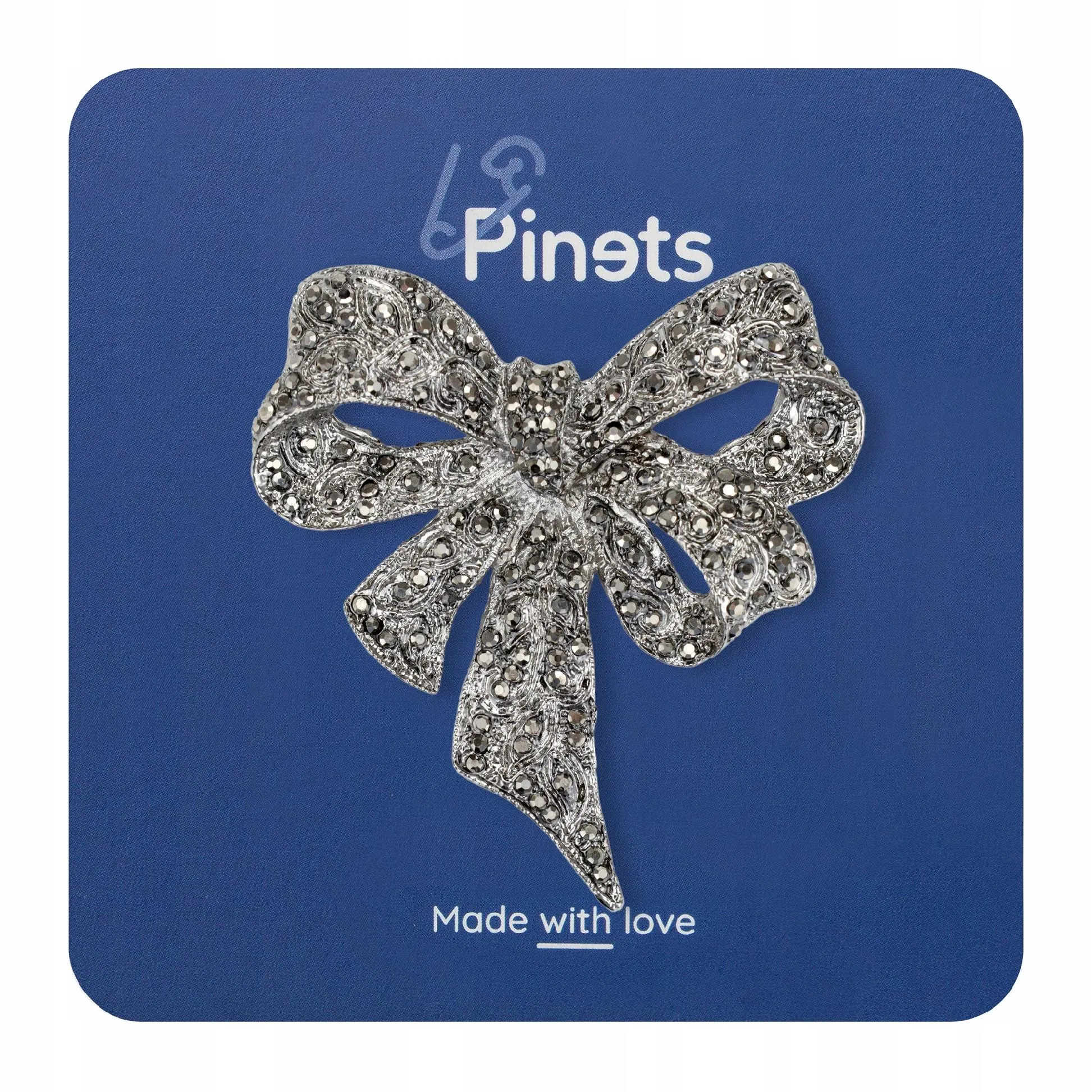 Silver bow with zircons - brooch